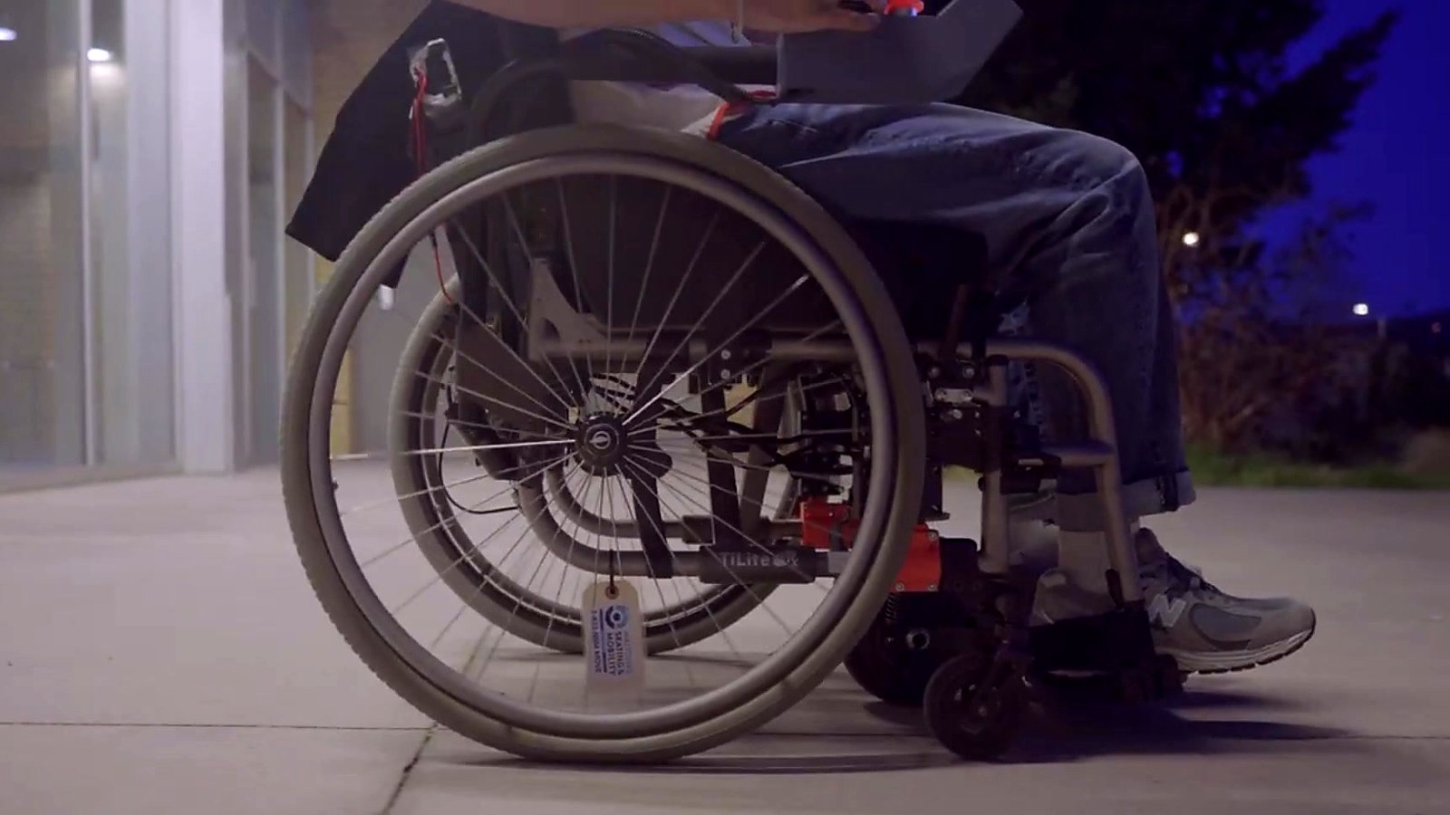 Side view of the prototype mounted below a manual wheelchair seat